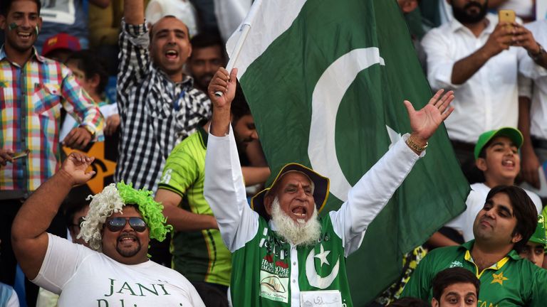 Pakistani spectators cheer at the Gaddafi Cricket Stadium in Lahore on September 15, 2017 before the start of the third and final Twenty20 International ma