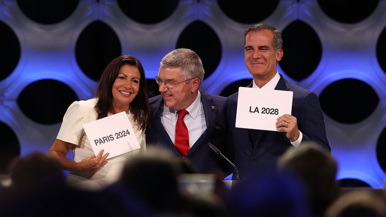 Paris mayor Anne Hidalgo, IOC president Thomas Bach and Los Angeles mayor Eric Garcetti react after confirmation