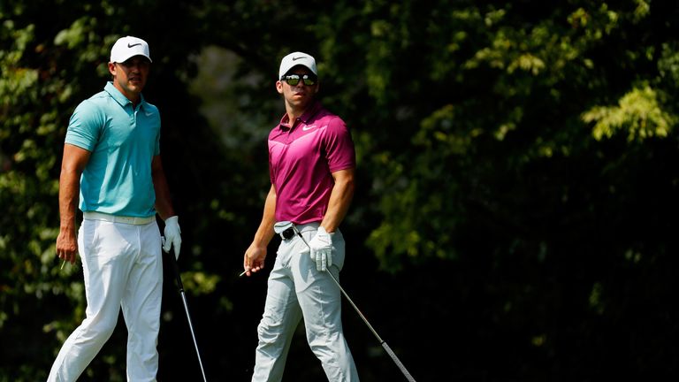 ATLANTA, GA - SEPTEMBER 21:  Brooks Koepka (L) of the United States and Paul Casey of England look on from the second tee during the first round of the TOU