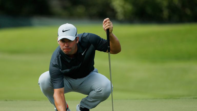 Paul Casey of England lines up a putt on the first green during the third round of the Tour Championship at East Lake Golf Club