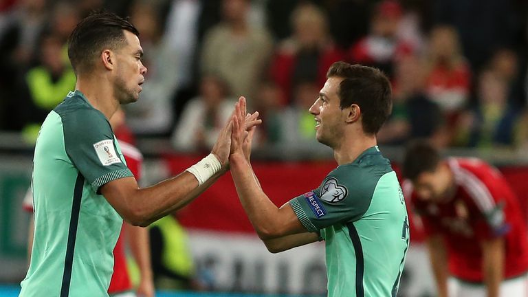 Portugal's Pepe (left) and Cédric Soares celebrate after victory