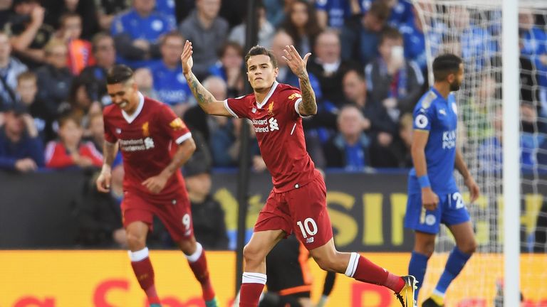 Philippe Coutinho celebrates after his free-kick put Liverpool 2-0 ahead