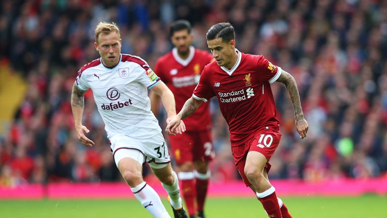 LIVERPOOL, ENGLAND - SEPTEMBER 16: Philippe Coutinho of Liverpool attempts to get past Scott Arfield of Burnley during the Premier League match between Liv