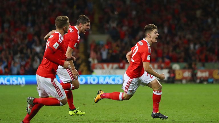 Ben Woodburn of Wales (22) celebrates as he scores their first goal during the FIFA 2018 World Cup Qualifier between Wales and Austria in Cardiff