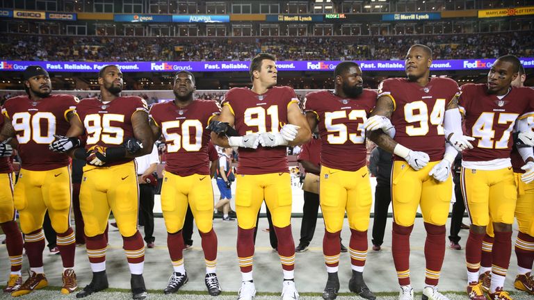 LANDOVER, MD - SEPTEMBER 24: Washington Redskins players during the the national anthem before the game against the Oakland Raiders at FedExField on Septem