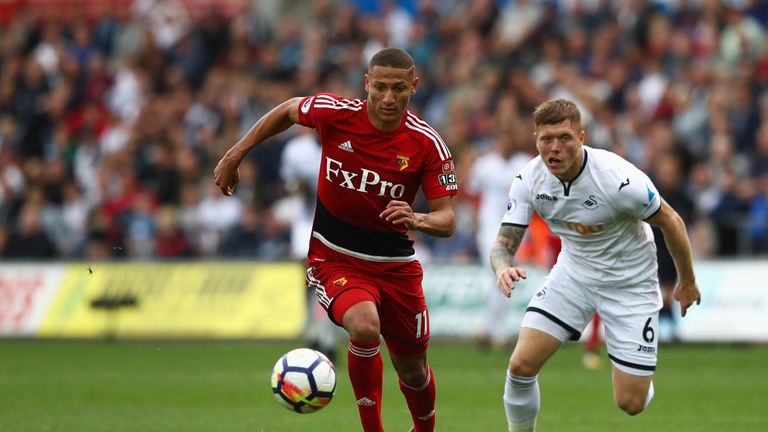 SWANSEA, WALES - SEPTEMBER 23:  Richarlison de Andrade of Watford controls the ball under pressure of Alfie Mawson of Swansea City during the Premier Leagu