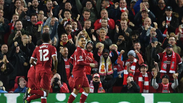 Liverpool's Brazilian midfielder Roberto Firmino celebrates after scoring during the UEFA Champions League Group E football match between Liverpool and Sev