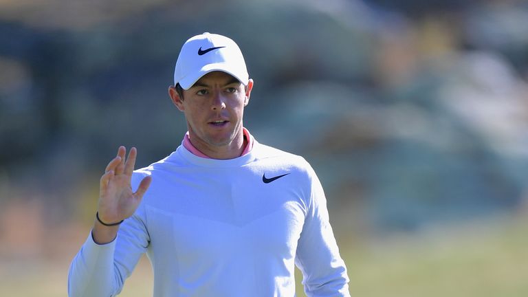 Rory McIlroy of Northern Ireland waves after putting for birdie on the 12th green during round two of the Dell Technologies Cha