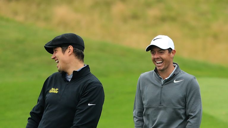 NEWCASTLE UPON TYNE, ENGLAND - SEPTEMBER 27: Presenter Vernon Kay and Rory McIlroy of Northern Ireland share a joke on the 6th hole during the pro am ahead