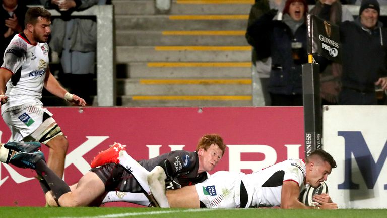 Rhys Patchell cannot prevent Jacob Stockdale from scoring a try