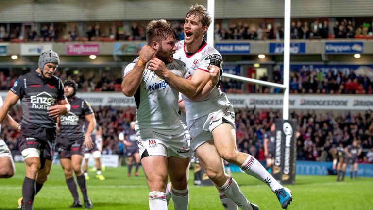 Andrew Trimble congratulates try scorer John Andrew