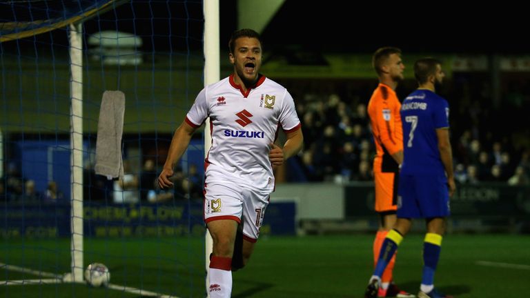 KINGSTON UPON THAMES, ENGLAND - SEPTEMBER 22: Ryan Seager of MK Dons celebrates after scoring his sides first goal during the Sky Bet League One match betw