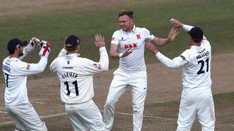 BIRMINGHAM, ENGLAND - SEPTEMBER 14:  Sam Cook of Essex celebrates with team mates after bowling out Jonathan Trott  during the Specsavers County Championsh