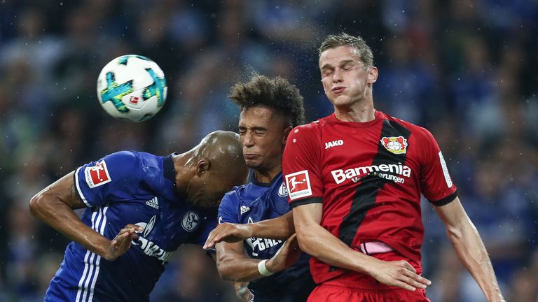 GELSENKIRCHEN, GERMANY - SEPTEMBER 29: Naldo  (L-R), Thilo Kehrer of Schalke and Sven Bender of Leverkusen battle for the ball during the Bundesliga match 