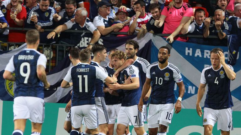 Scotland's defender Stuart Armstrong (C) celebrates scoring the 1-0 goal with his team-mates during the FIFA World Cup 2018 qualification football match be