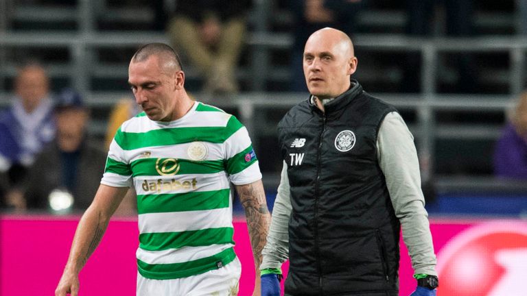 Celtic's Scott Brown (left) limps off injured