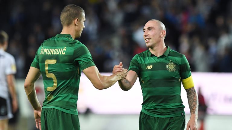 Celtic's Scott Brown embraces Jozo Simunovic (left) at full-time in Rosenberg on Aug 2, 2017, in CL qualifying play-off