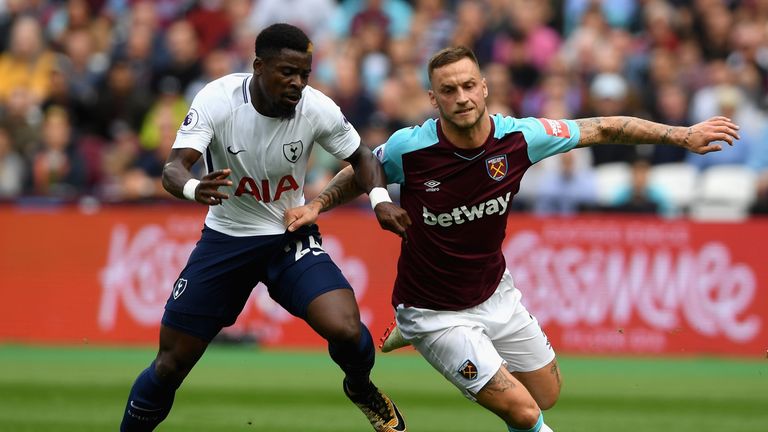 LONDON, ENGLAND - SEPTEMBER 23: Serge Aurier of Tottenham Hotspur and Marko Arnautovic of West Ham United battle for possession during the Premier League m