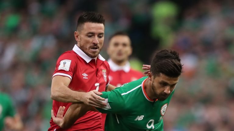 Republic of Ireland's Shane Long and Serbia's Antonio Rukavina battle for the ball 