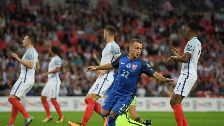 England players look dejected as Stanislav Lobotka of Slovakia celebrates as he scores in the World Cup Qualifier