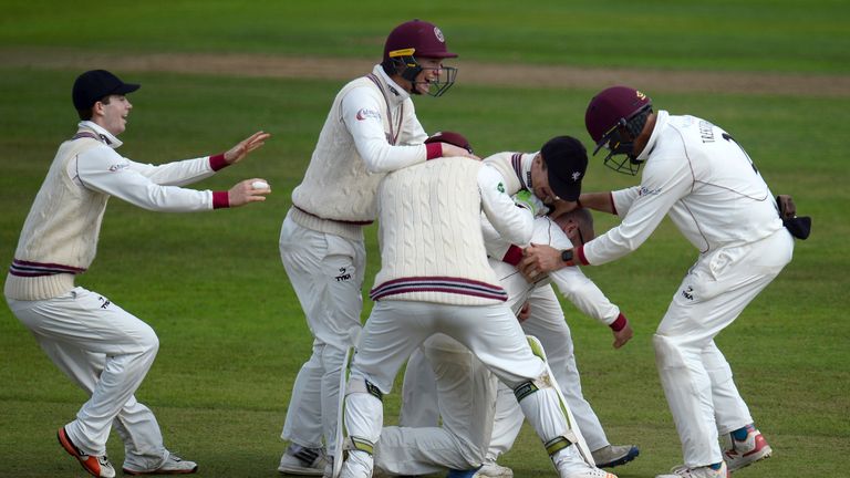 TAUNTON, ENGLAND - SEPTEMBER 28: The Somerset side celebrate the wicket of Steven Finn of Middlesex meaning that they avoid relegation during Day Four of t