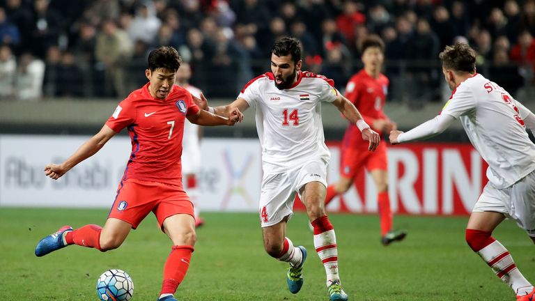 SEOUL, SOUTH KOREA - MARCH 28:  Son Heung-Min of South Korea competes for the ball with Hag Mohamad Tamer of Syria during the FIFA World Cup Qualification 