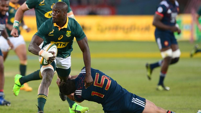 Raymond Rhule of the Springboks tackled by Brice Dulin