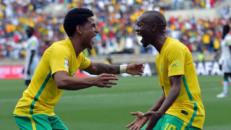 South Africa's Thulani Serero (R) celebrates with South Africa's Keegan Dolly (L) after scoring a goal during the 2018 World Cup qualifying football match 