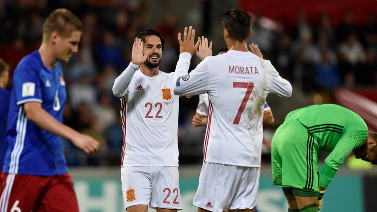 Spain's Isco ((C)) celebrates with teammate  Alvaro Morata (2nd R) after scoring a goal during the FIFA World Cup 2018 qualification football match between