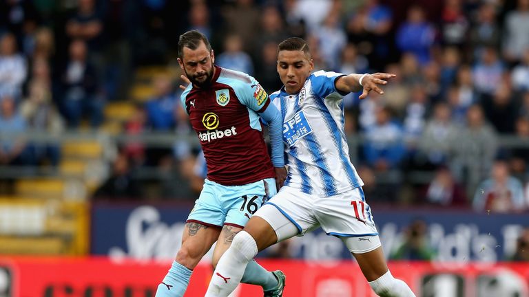 BURNLEY, ENGLAND - SEPTEMBER 23:  Abdelhamid Sabiri of Huddersfield Town and Steven Defour of Burnley compete for the ball during the Premier League match 