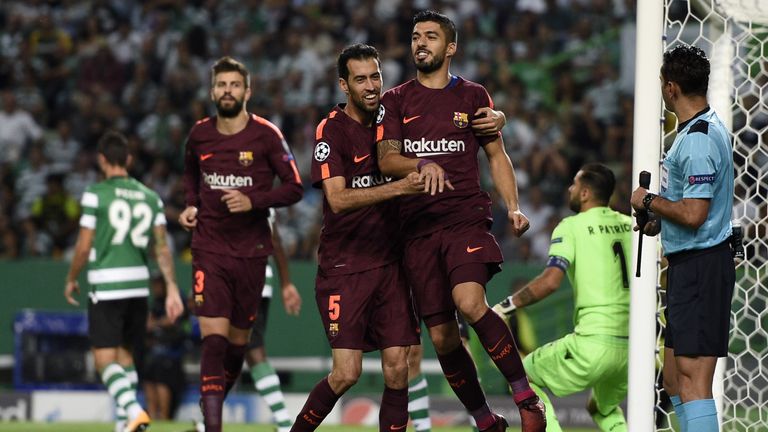 Sergio Busquets and Luis Suarez celebrate after scoring