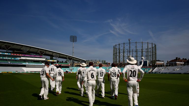 LONDON, ENGLAND - AUGUST 28:  Surrey make their way to the field to start the first innings on day one of the Specsavers County Championship Division One m