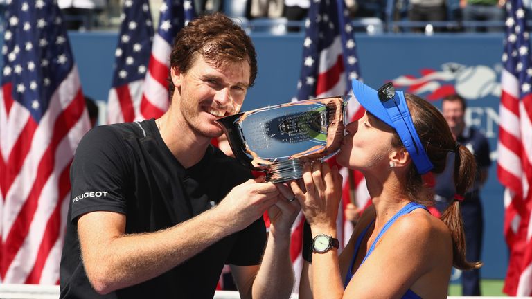 Jamie Murray of Great Britain and Martina Hingis of Switzerland pose during the trophy presentation after defeating Hao-Ching at US Open