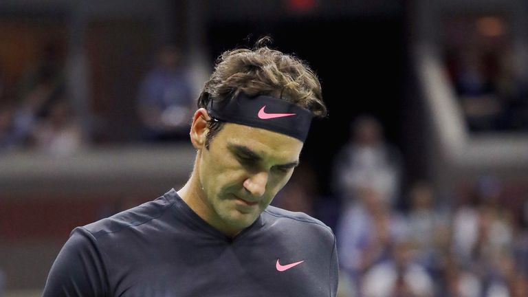 Roger Federer of Switzerland reacts against Philipp Kohlschreiber of Germany during their men's singles fourth round match at the US Open