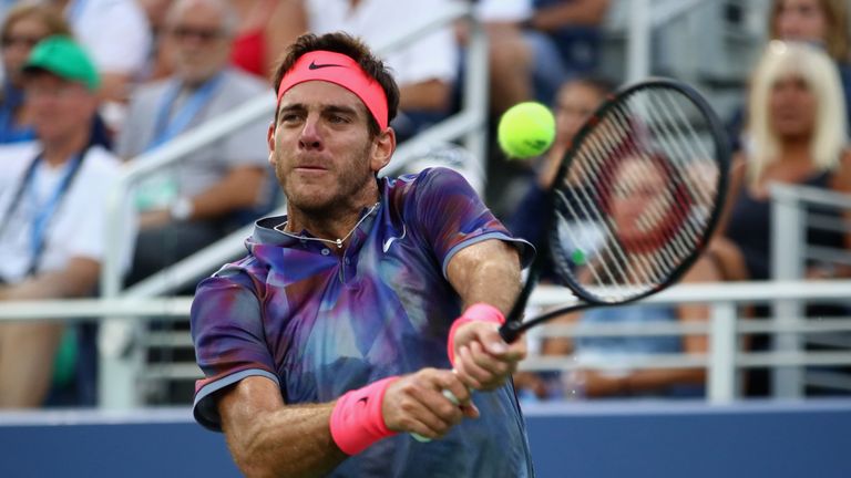 Juan Martin del Potro of Argentina returns a shot against Dominic Thiem of Austria during their fourth round Men's Singles match at US Open
