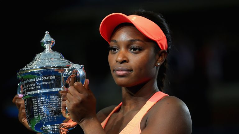 Sloane Stephens of the United States poses with the championship trophy during the trophy presentation after defeating Madison Keys at US Open