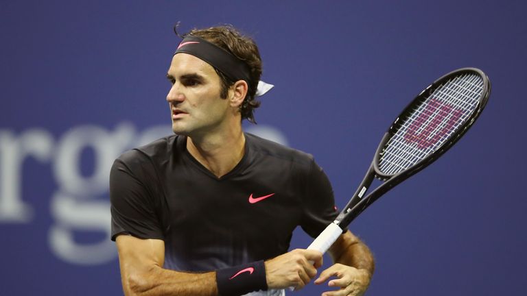 Roger Federer of Switzerland returns a shot against Juan Martin del Potro of Argentina during their Men's Singles Quarterfinal at US Open