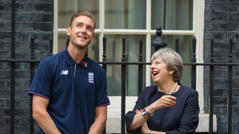 Prime Minister Theresa May speaks to England Captain Stuart Broad as they watch a game of street cricket on Downing Street, London, organised by Chance to 