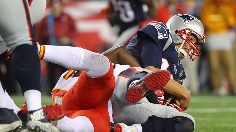 FOXBORO, MA - SEPTEMBER 07:  Tom Brady #12 of the New England Patriots is sacked during the second half against the Kansas City Chiefs at Gillette Stadium 