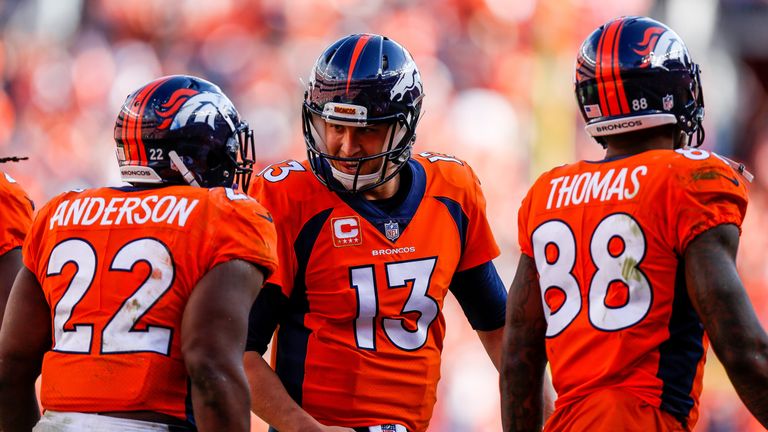 DENVER, CO - SEPTEMBER 17:  Running back C.J. Anderson #22 of the Denver Broncos celebrates with quarterback Trevor Siemian #13 after a catch and run touch