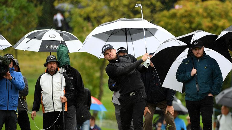 Tyrell Hatton of England hits his second shot on the 16th hole during day two of the British Masters at Close House