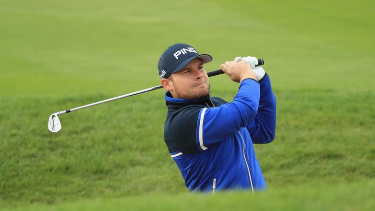 Tyrrell Hatton of England plays his second shot on the third hole during the third round of the British Masters