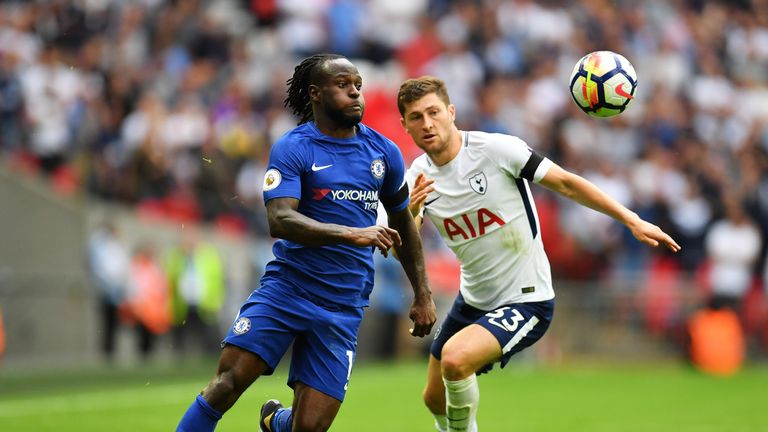 LONDON, ENGLAND - AUGUST 20: Victor Moses of Chelsea and Ben Davies of Tottenham Hotspur battle for possession.