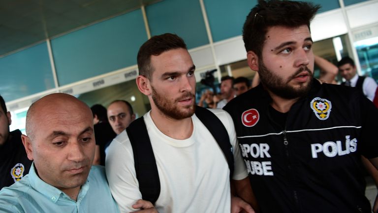 Spurs striker Vincent Janssen is given a police escort upon his arrival at Ataturk International airport in Istanbul