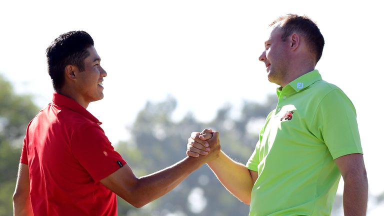 Collin Morikawa of the United States shakes hands with Paul McBride of Great Britain and Ireland after a three and two win 