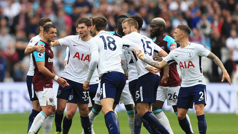 LONDON, ENGLAND - SEPTEMBER 23:  Javier Hernandez of West Ham United and Fernando Llorente of Tottenham Hotspur clash during the Premier League match betwe