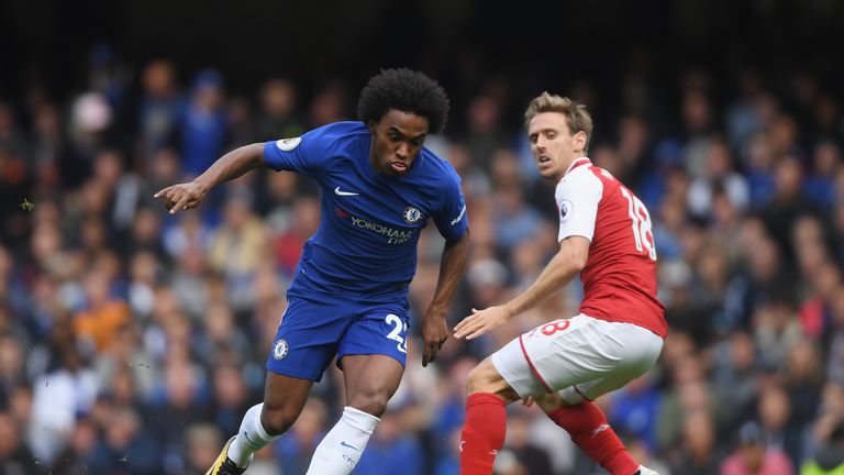 Willian of Chelsea attempts to get past Nacho Monreal of Arsenal during the Premier League match between Chelsea and Arsenal