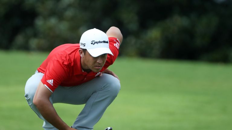 Xander Schauffele of the United States lines up a putt during the third round of the Tour Championship at East Lake Golf Club 