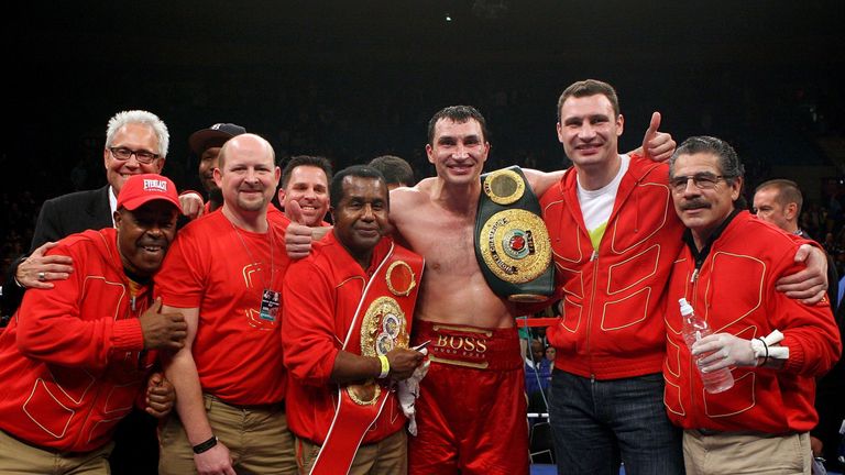 NEW YORK - NOVEMBER 11:  Wladimir Klitschko of Ukraine (C), his trainer, Emanuel Steward (fourth from left), his brother Vitali Klitschko (second from righ