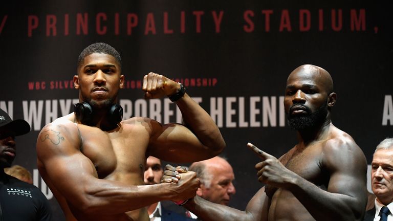 CARDIFF, WALES - OCTOBER 27:  Anthony Joshua of England (L) and Carlos Takam of France (R) pose for photos during a weigh-in prior to tomorrow's world heav